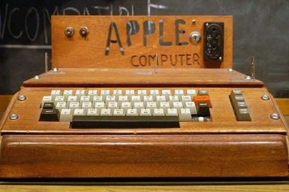 Photo of one of the first Apple computers in a wooden case