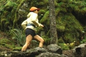 Screenshot from REI's "Uncommon Path" blog showing a female running in a forest