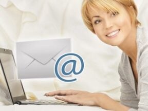 A female in front of a laptop engaging with email