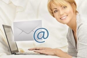 A female in front of a laptop engaging with email