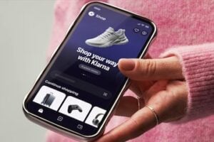 Image from Klarna of a hand holding a smartphone withe the Klarna app on it