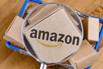 Amazon shipping boxes behind a magnifying glass