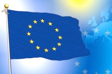 E.U. flag superimposed over a E.U. map