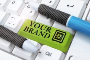 Illustration of the word "Brand" on a keyboard return key