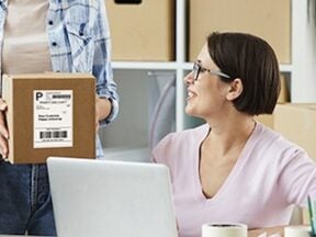 Image from Ship.com of a female receiving a parcel