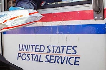 Image of USPS logo on the side of a delivery truck