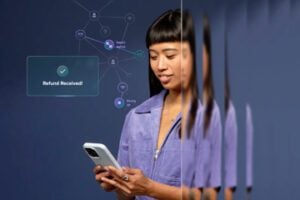 Image from Riskified of a female holding a smartphone