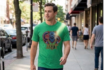 Image from Asset Studio of male wearing a t-shirt while walking on a sidewalk