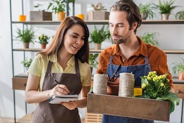Stock photo of a female and male in a florist shop