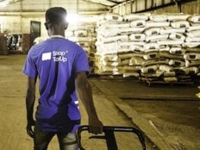 Warehouse worker at TradeDepot pulling a pallet jack
