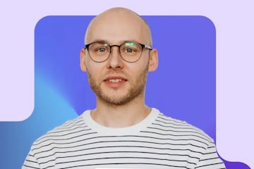 Image from Yuma AI of a male holding a computer tablet