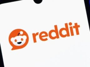 Reddit logo on a smartphone screen