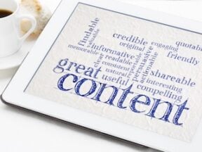 great content writing word cloud on a digital tablet with a cup of coffee - business writing and content marketing concept