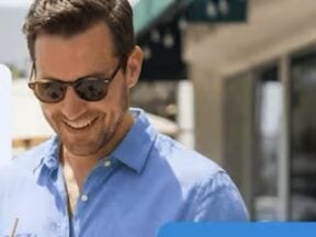 Image from EZ Texting of male looking at a smartphone