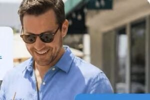 Image from EZ Texting of male looking at a smartphone