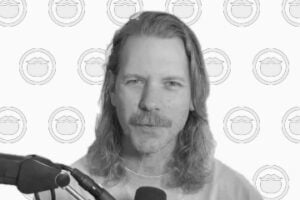 Grayscale photo of Eric with Beardbrand icons on the background