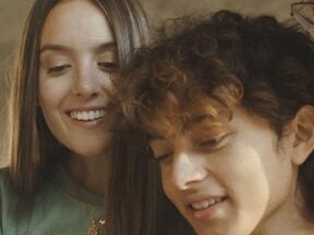 Image from RedotPay of a male and female looking at a phone