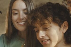 Image from RedotPay of a male and female looking at a phone