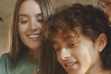 Image from RedotPay of a male and female looking at a phone
