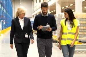2 females and 1 male in an ecommerce warehouse