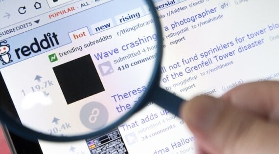 Screenshot of a Reddit thread behind a magnifying glass Screenshot of a Reddit thread behind a magnifying glass