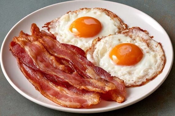 Photo of a plate with bacon and eggs Photo of a plate with bacon and eggs