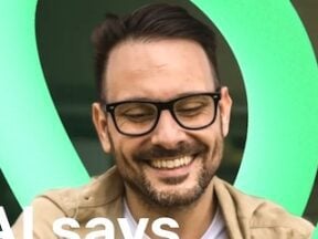 Image from Trustpilot of a male looking at a smartphone
