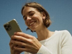 Image from Attentive of a female holding a smartphone