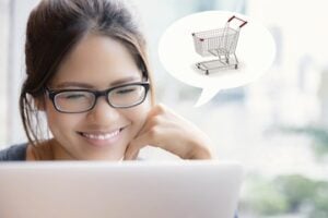Female age in 20s looking at a laptop