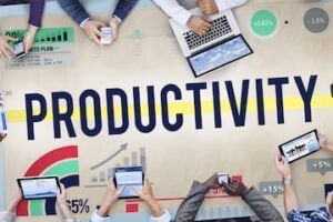 Illustration of the word "Productivity" on a conference table