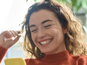 Image from EasyShop of a female looking at her smartphone