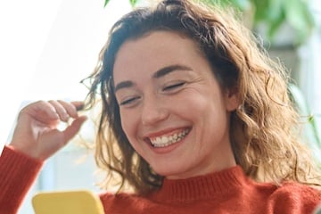 Image from EasyShop of a female looking at her smartphone