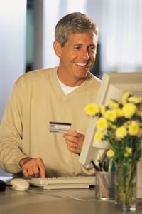 A Man Shops Online.